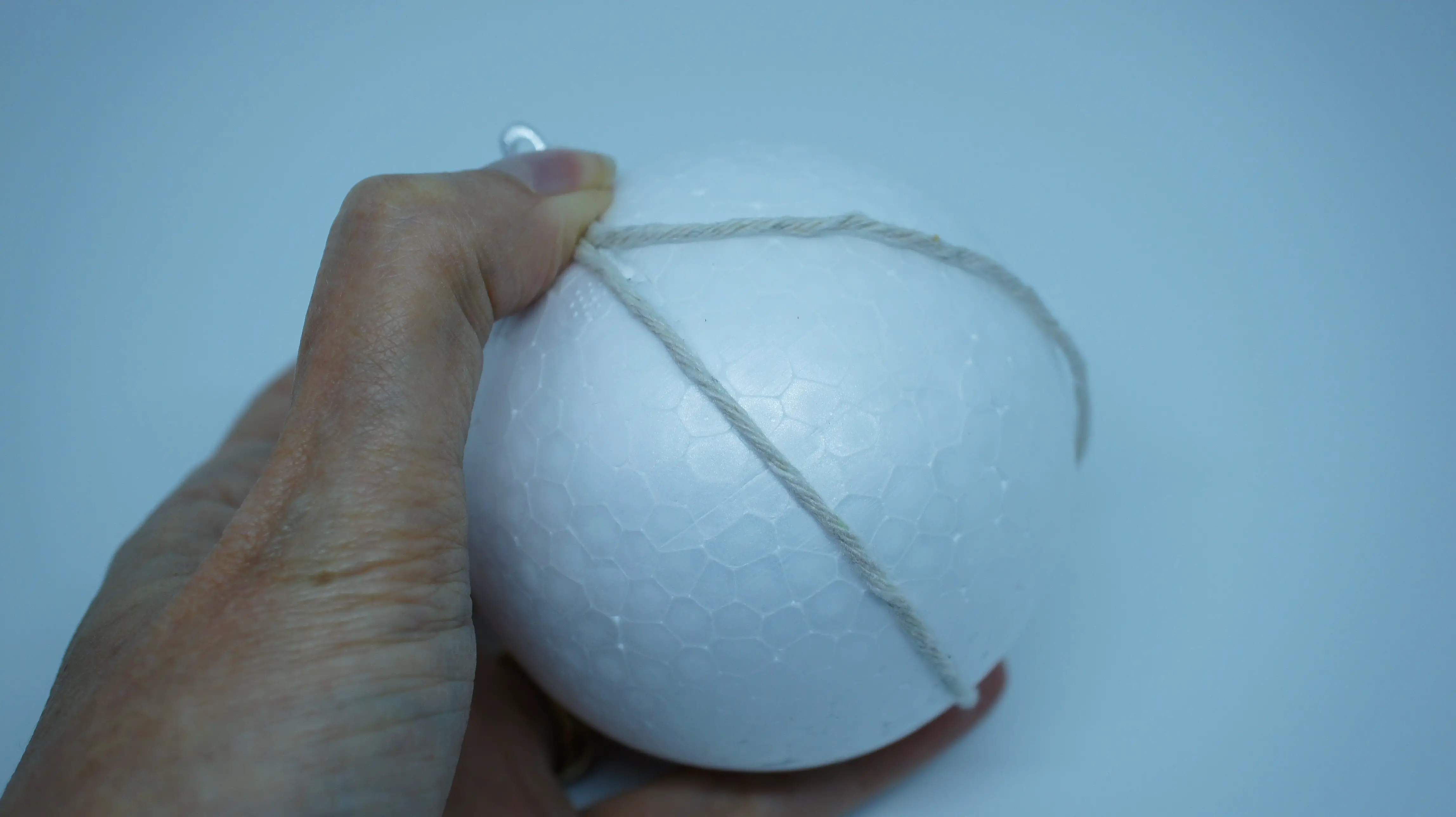 string wrapped around styrofoam ball