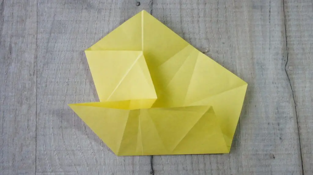 Two folds together to form point