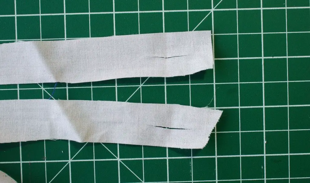 slits cut into strips of fabric