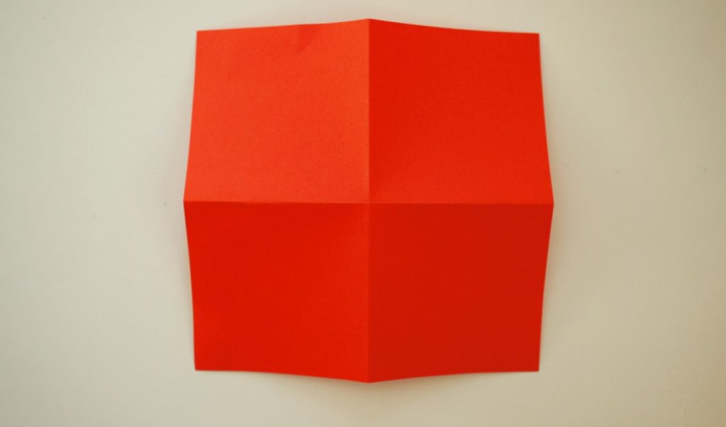 folded square of paper turned over