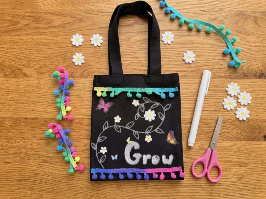 kids craft decorating a bag