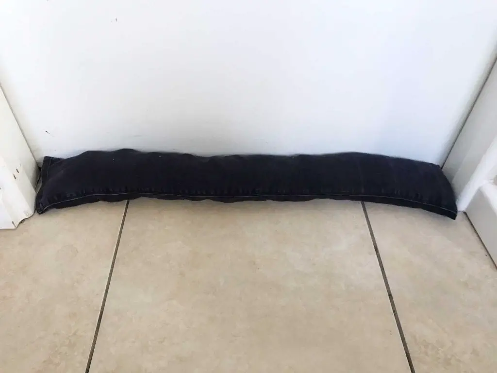black denim draught excluder in place