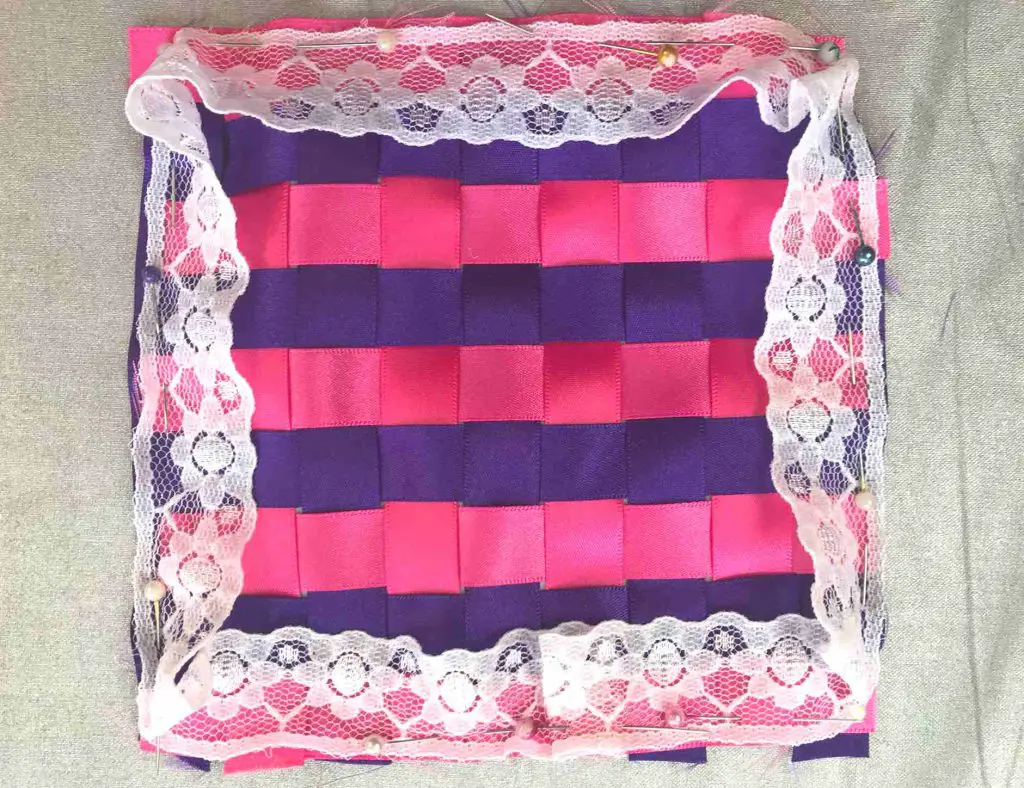 adding trim to ribbon cushion