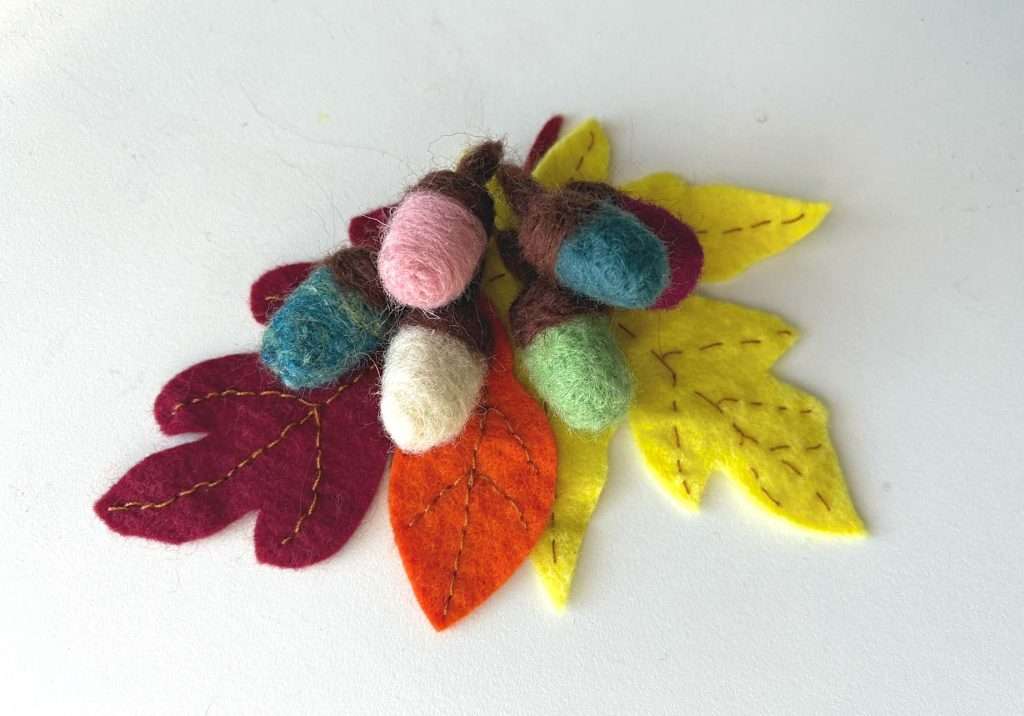 needle felted acorns on felt leaves