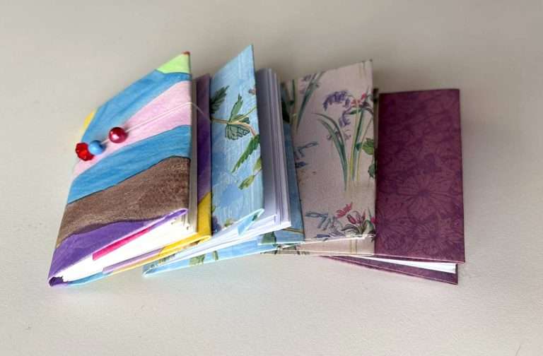 4 miniature notebooks
