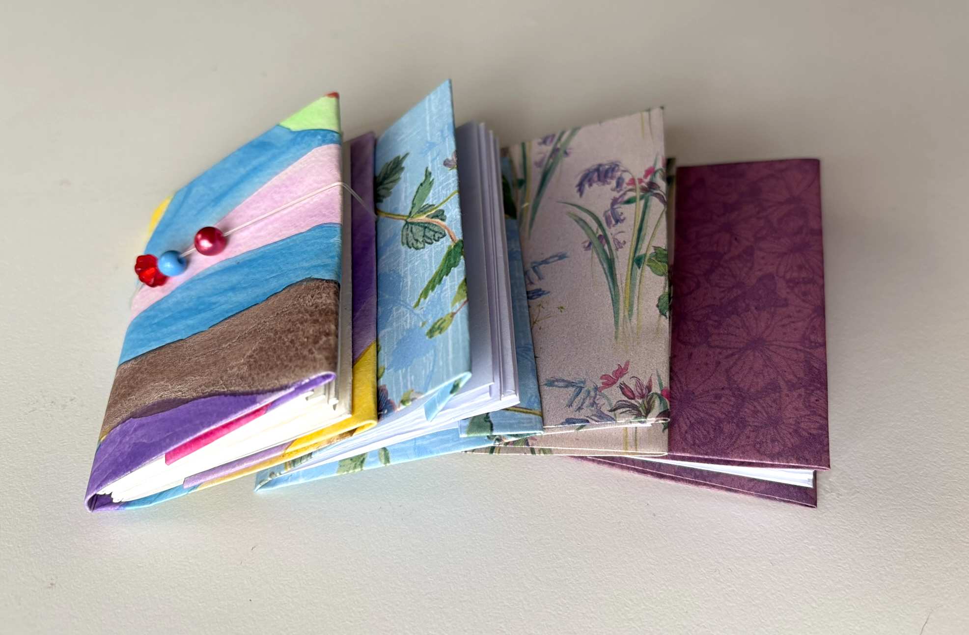 4 miniature notebooks