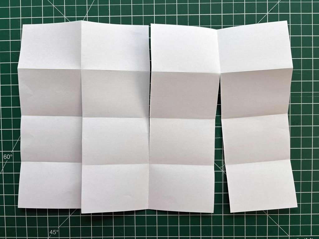 copier paper cut ready to fold into a miniature notebook