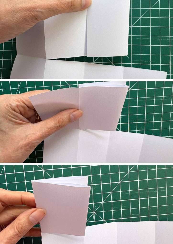 folding pages of miniature notebook