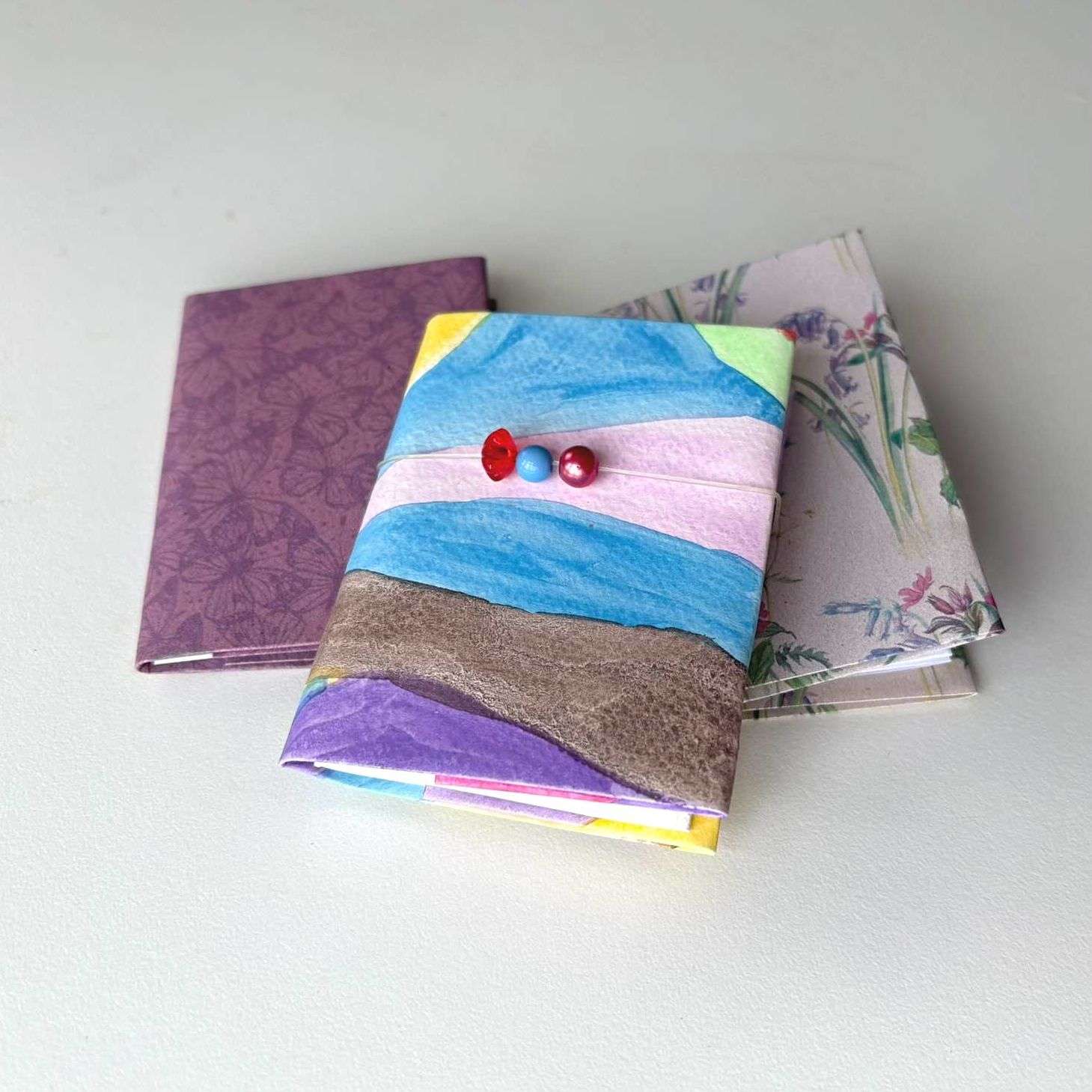 3 miniature notebooks