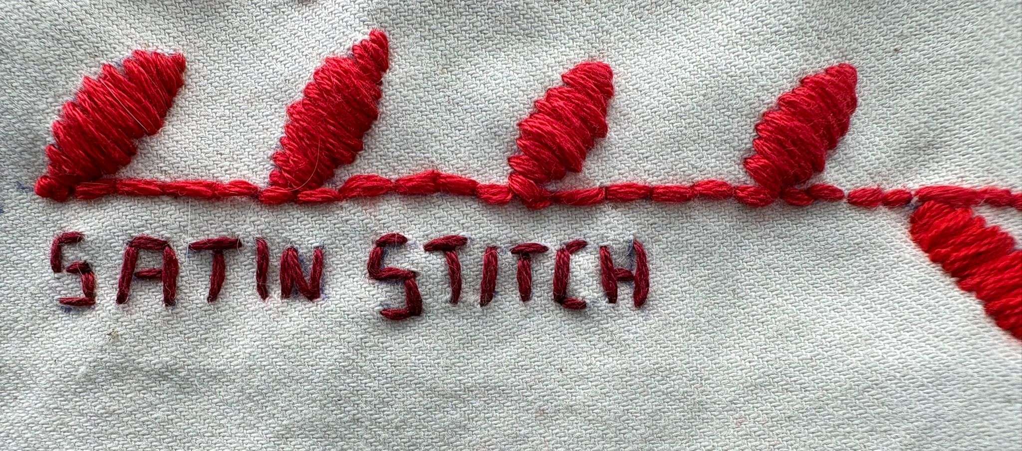red satin stitched leaves
