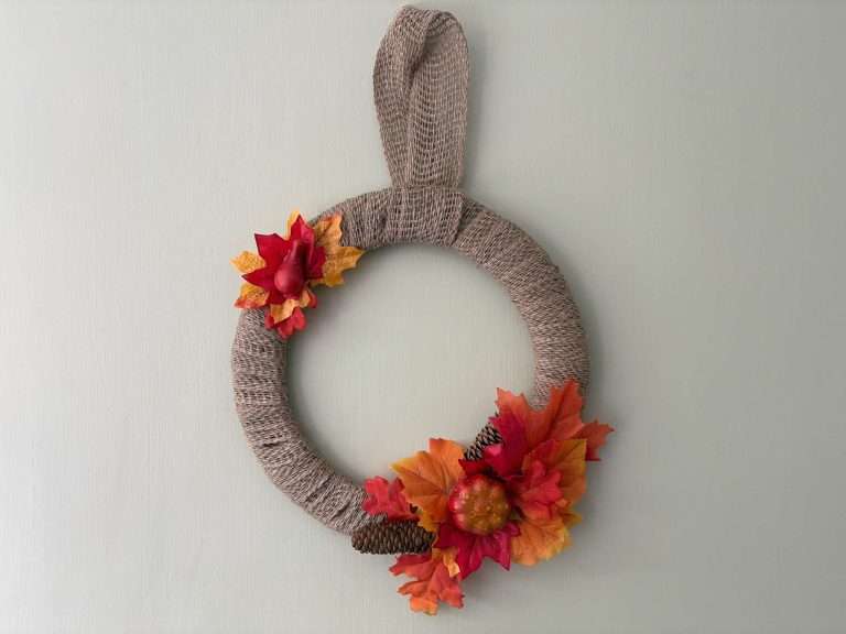 burlap autumn wreath with orange and red leaves