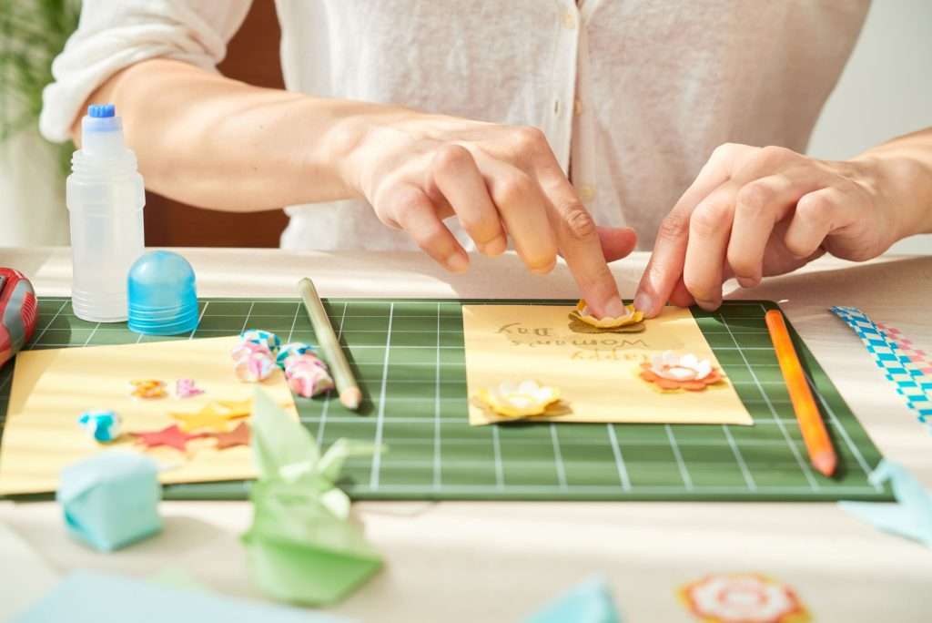 crafting person making cards