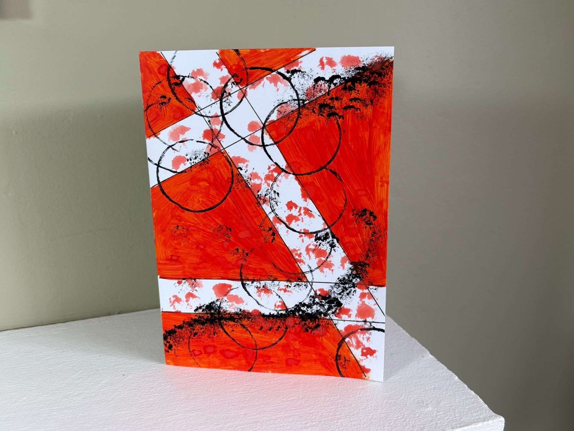 red geometric mixed media card