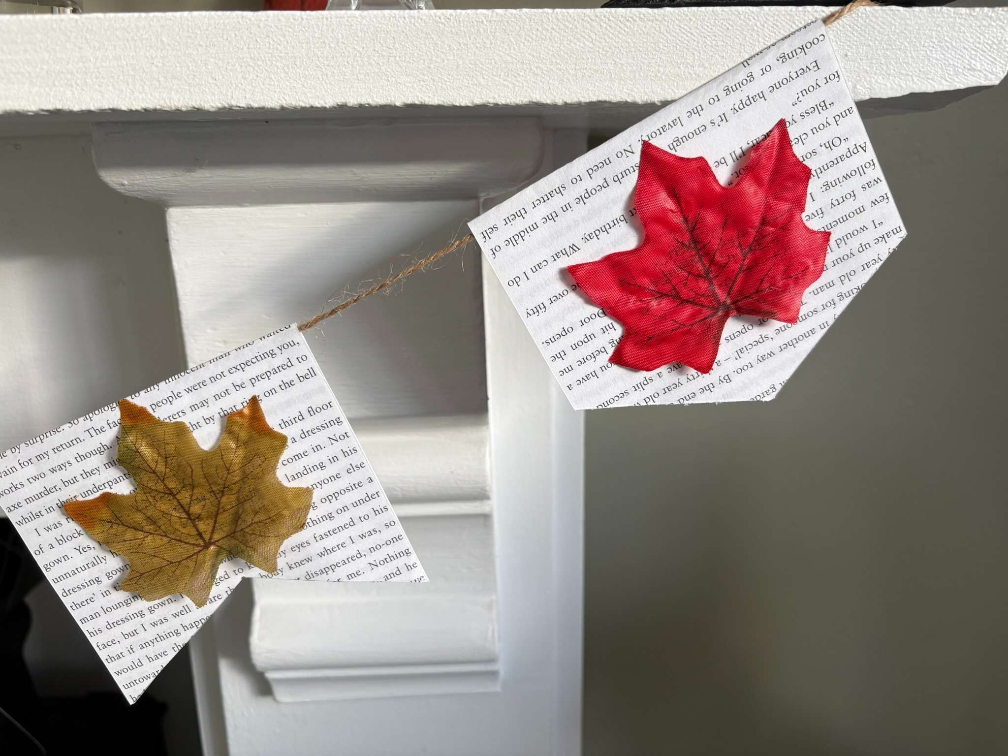 part of autumn leaf and book page garland showing 2 'flags'