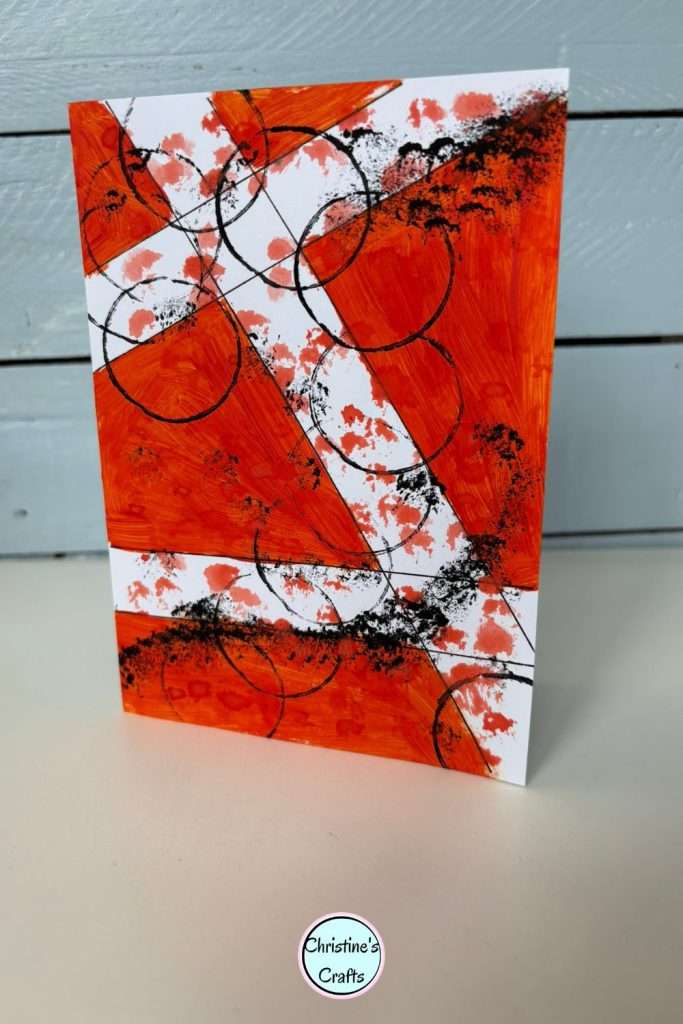 Pinterest pin showing red geometric greeting card