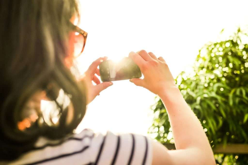 woman taking a photo small