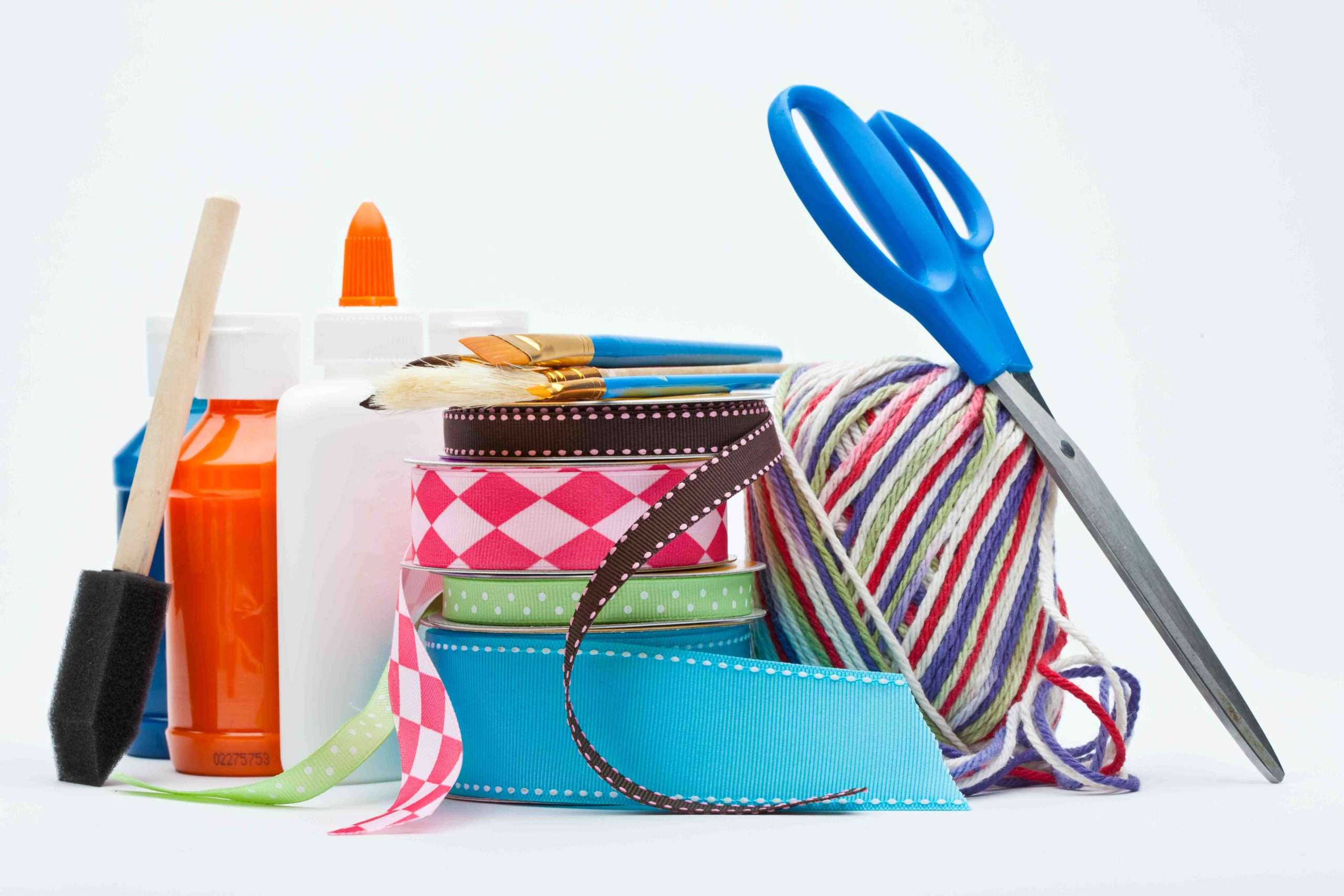 craft supplies including ribbon and scissors